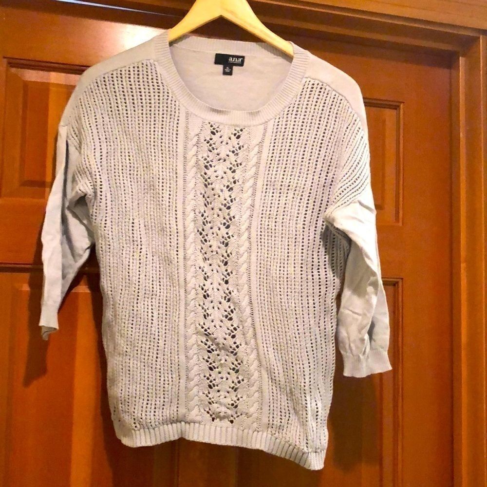 Ana gray cable knit sweater.